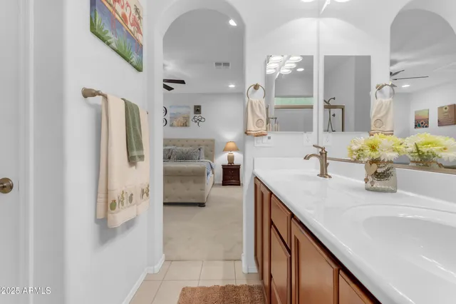 a bedroom with a bed and a couch