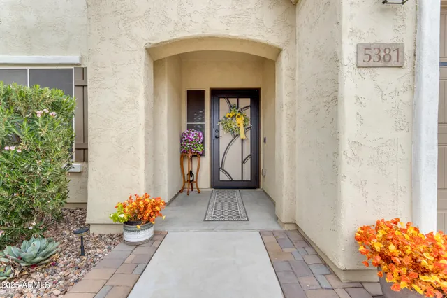 a bathroom with a granite countertop sink and a window