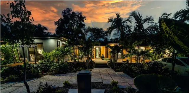 a view of a backyard of the house