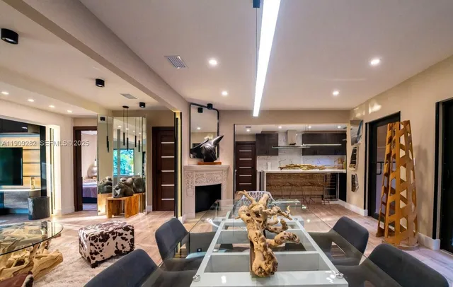 a living room with fireplace furniture and a flat screen tv