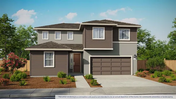 a front view of a house with garage