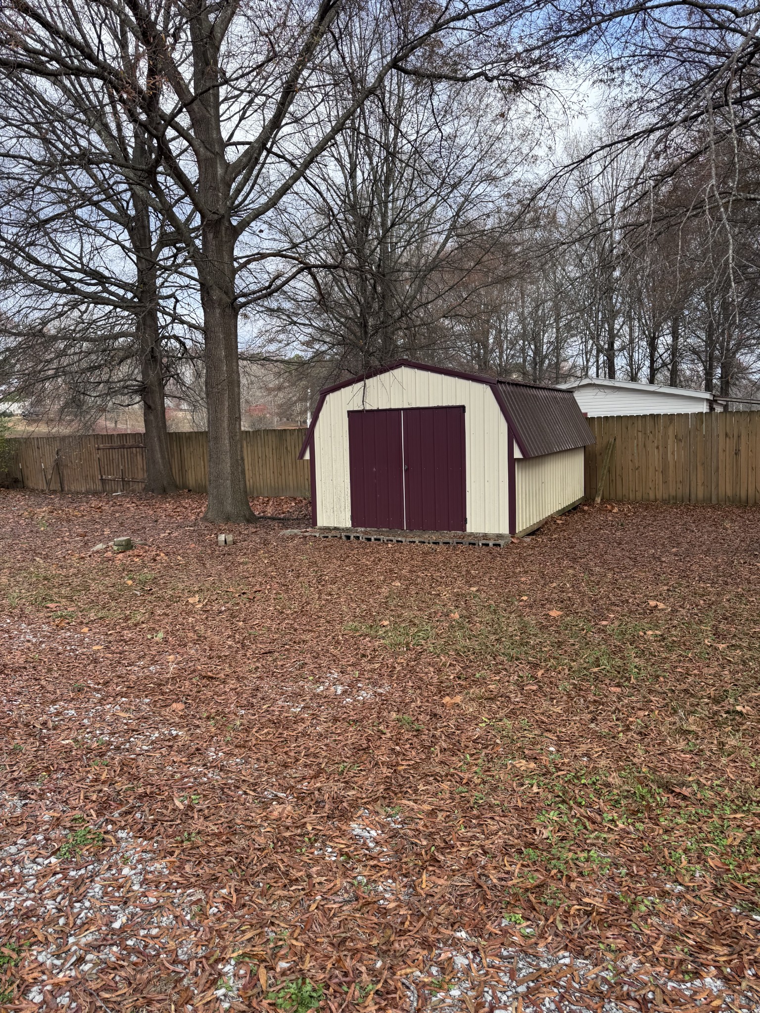 3392 Bates Road Lyles, TN 37098 - Photo 15 of 15 a view of backyard with tree and wooden fence