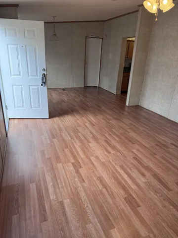 a view of a livingroom with wooden floor