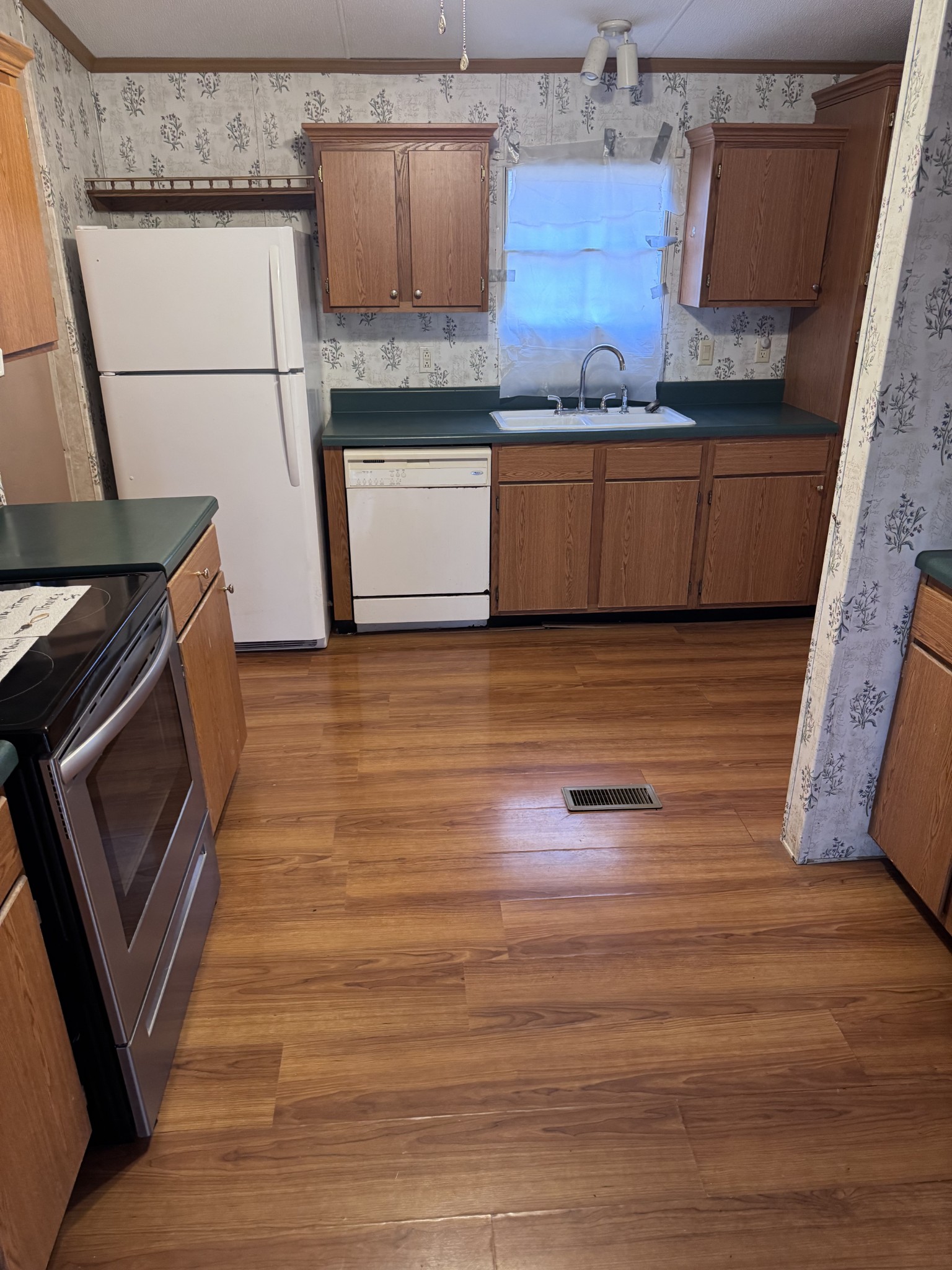 3392 Bates Road Lyles, TN 37098 - Photo 6 of 15 a kitchen with granite countertop a stove and a microwave