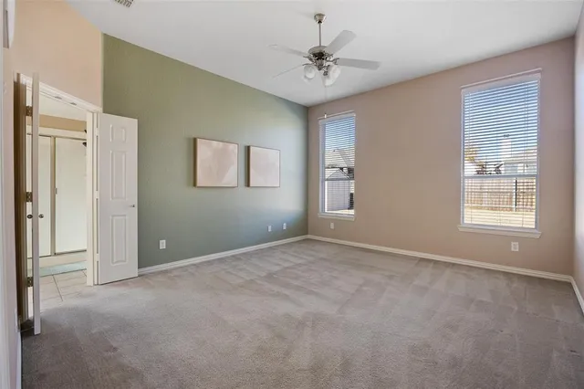 a spacious bathroom with a bathtub a sink and a mirror