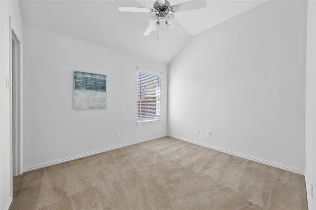 a bathroom with a shower and a glass door