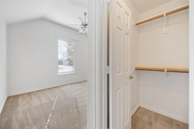 a bathroom with a sink vanity mirror and toilet