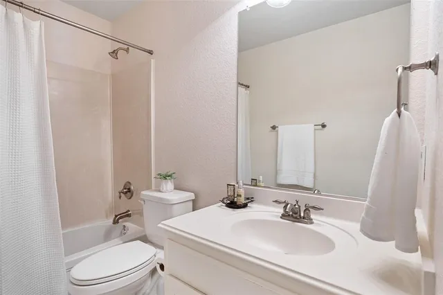 an aerial view of a building with parking space