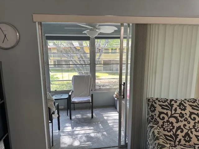 a view of a door and chair in a room
