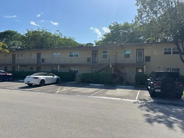 a view of a car parked in front of a house