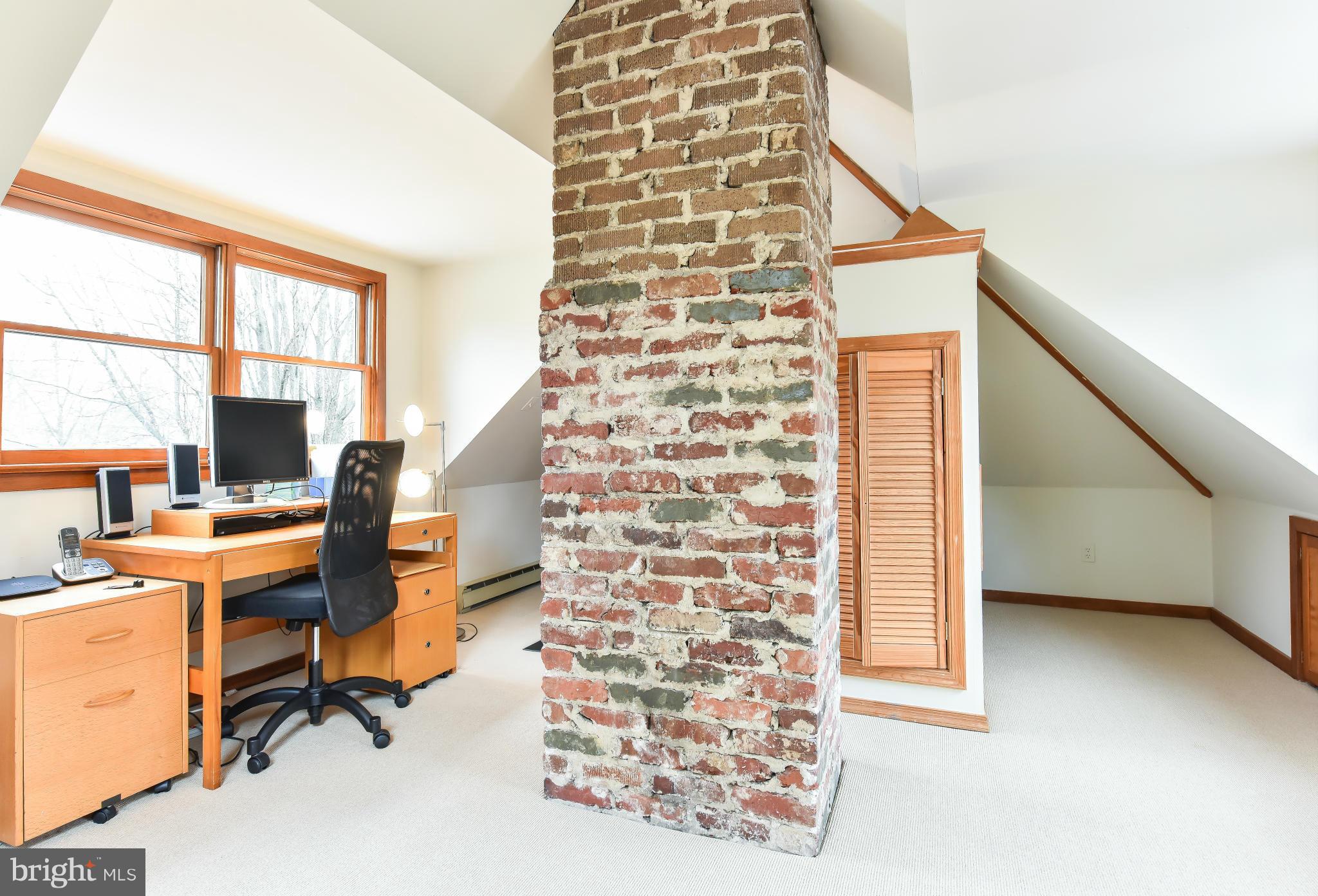 5517 Broad Branch Road Northwest Washington, DC 20015 - Photo 20 of 25 a view of a workspace with furniture and a window