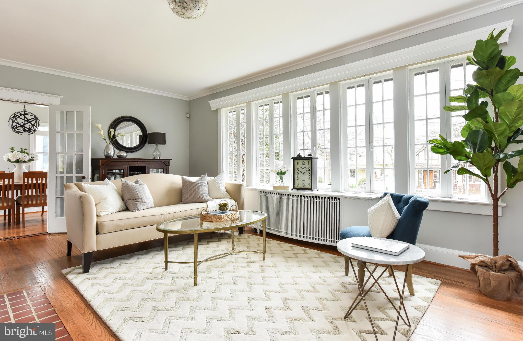 5517 Broad Branch Road Northwest Washington, DC 20015 - Photo 5 of 25 a living room with furniture and a large window