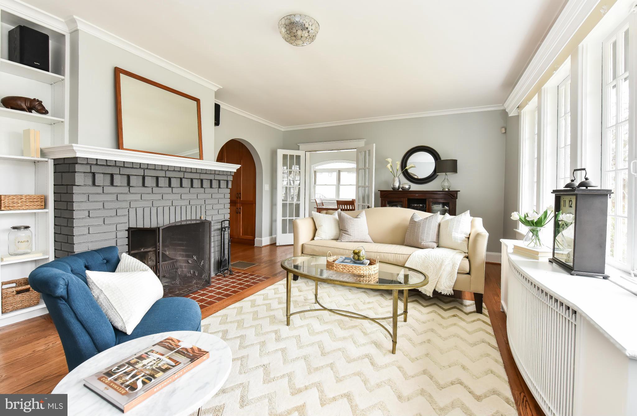 5517 Broad Branch Road Northwest Washington, DC 20015 - Photo 6 of 25 a living room with furniture and a fireplace