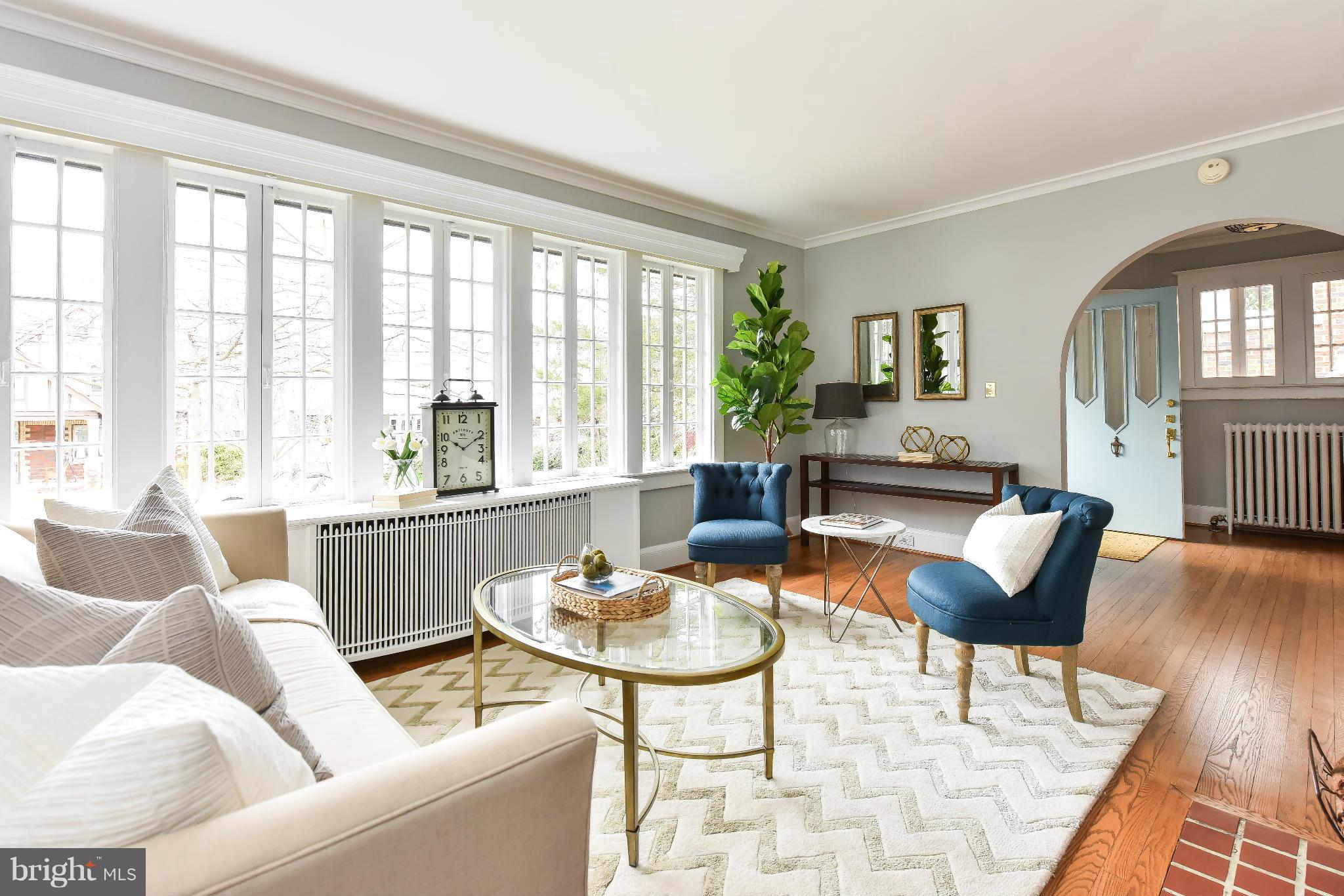 5517 Broad Branch Road Northwest Washington, DC 20015 - Photo 7 of 25 a living room with furniture and a large window