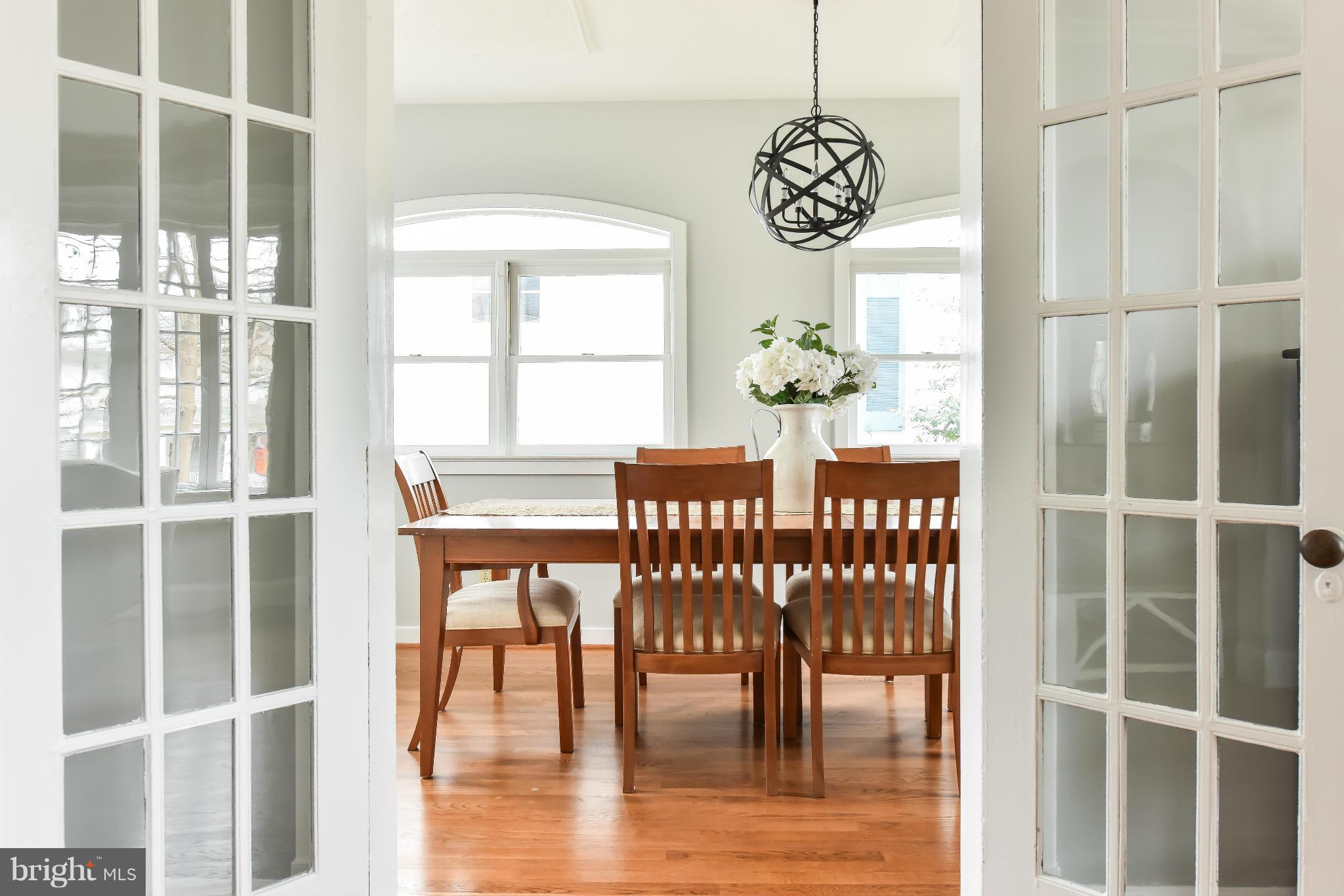 5517 Broad Branch Road Northwest Washington, DC 20015 - Photo 8 of 25 a view of a dining room with furniture window and wooden floor
