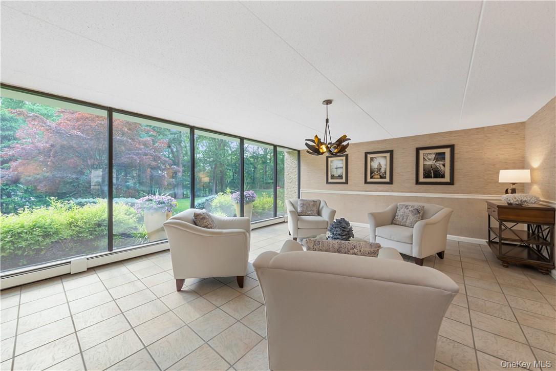 150 Overlook Avenue, Unit 2K Peekskill, NY 10566 - Photo 19 of 26 a living room with furniture and a large window
