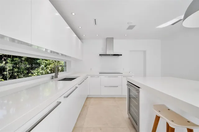 a kitchen with a sink and a stove