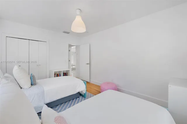 a bathroom with a double vanity sink toilet and shower