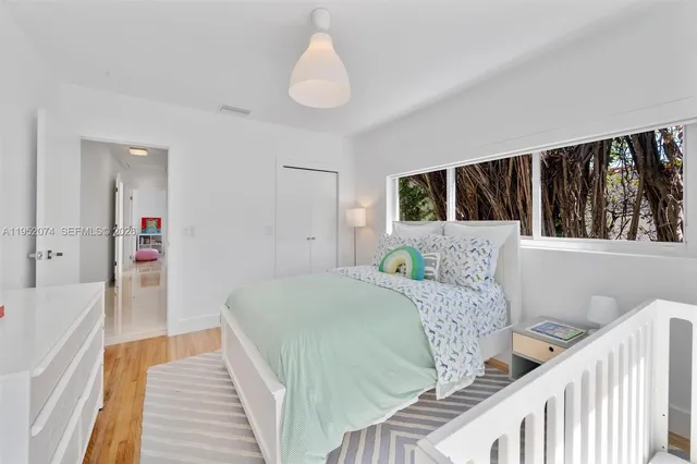 a room with furniture a flat screen tv and a table