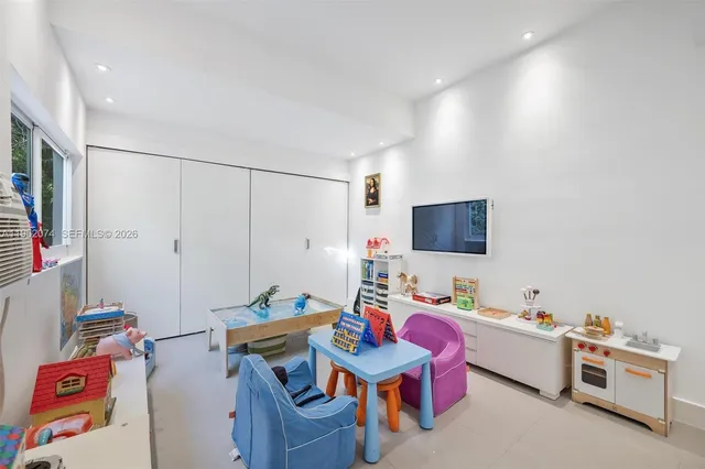 a view of bedroom with wooden floor