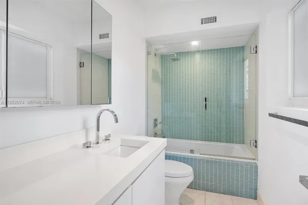 a bathroom with a sink a toilet and a bathtub