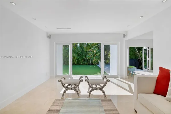 a living room with furniture and a yard