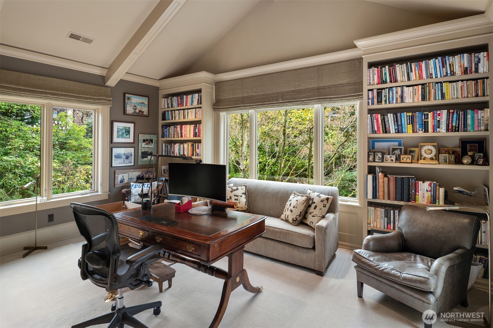 3814 East John Street Seattle, WA 98112 - Photo 19 of 26 a living room with furniture and a book shelf