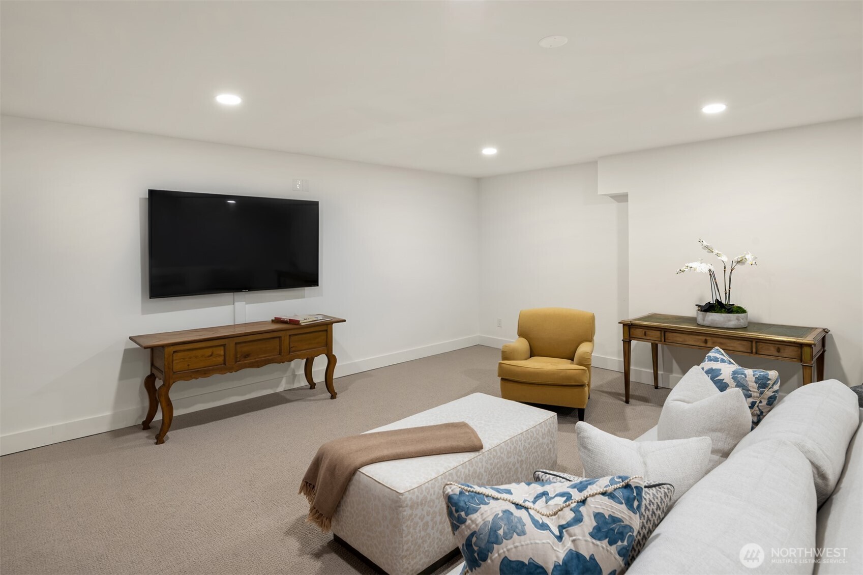 3814 East John Street Seattle, WA 98112 - Photo 24 of 26 a bedroom with furniture and a flat screen tv