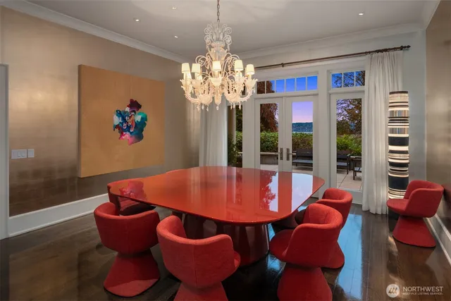 a view of a dining room with furniture and chandelier