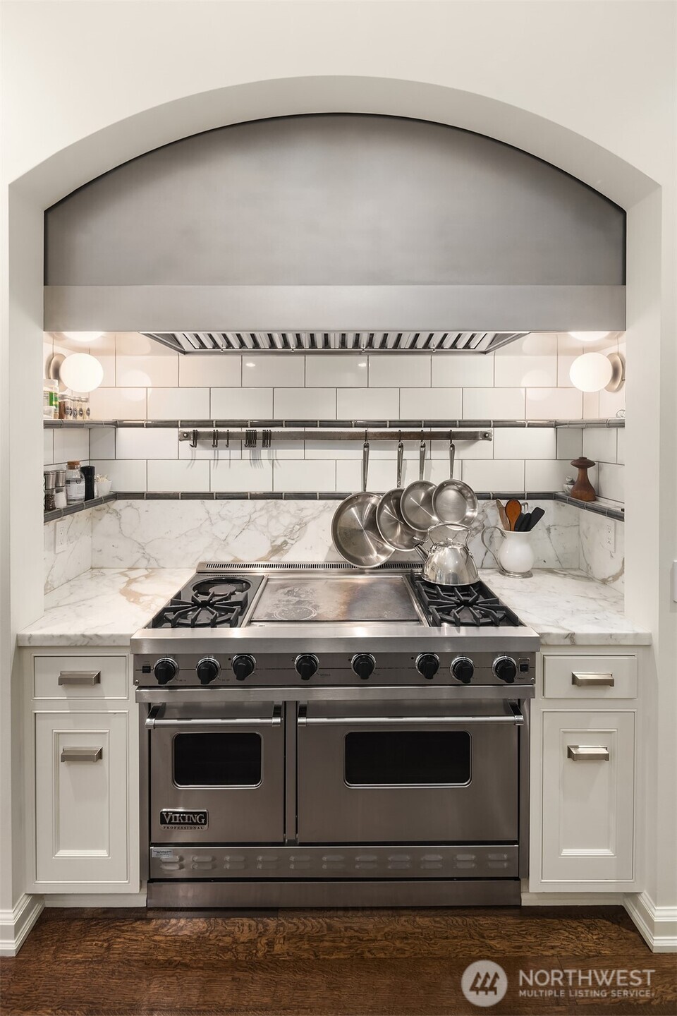 3814 East John Street Seattle, WA 98112 - Photo 10 of 26 a stove top oven sitting inside of a kitchen