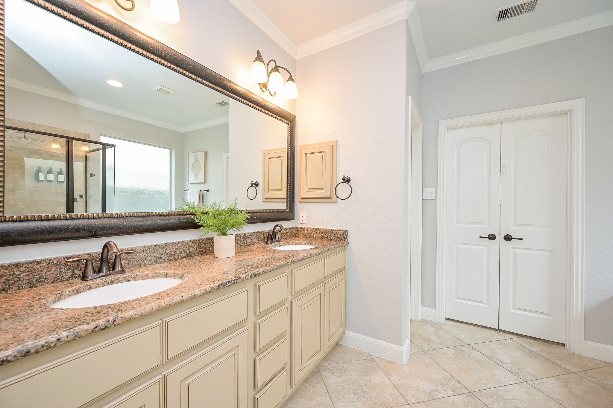 11 South Victoriana Circle Spring, TX 77389 - Photo 22 of 38 a bathroom with a granite countertop sink and a mirror