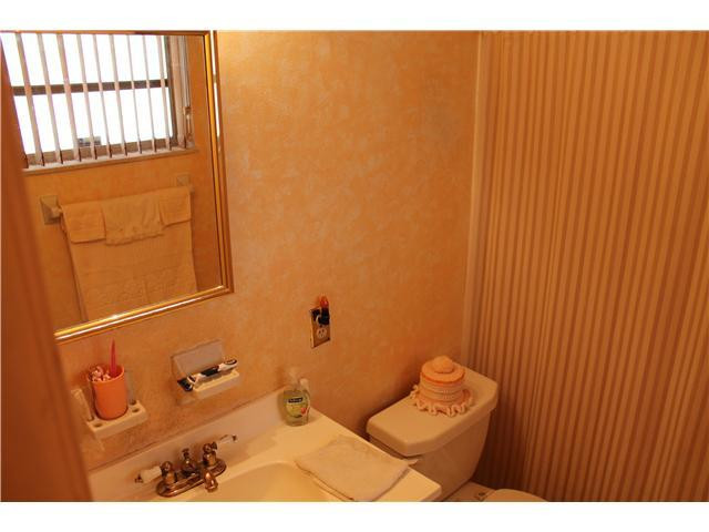 22369 Boulder Street Boca Raton, FL 33428 - Photo 9 of 15 a bathroom with a window