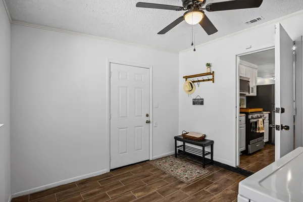 a view of livingroom with hardwood floor and a ceiling fan