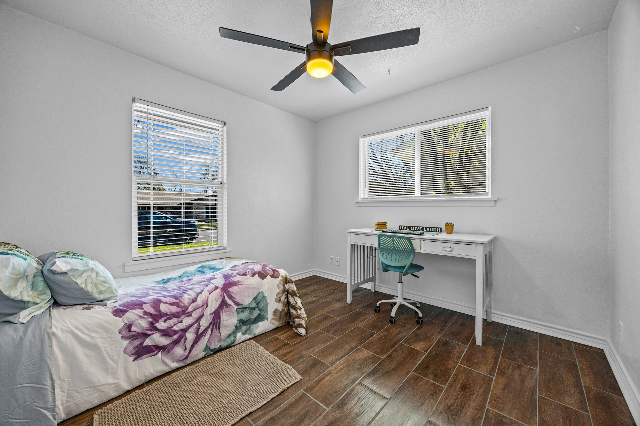 6010 Waycross Drive Austin, TX 78745 - Photo 19 of 22 a bedroom with a bed and a window