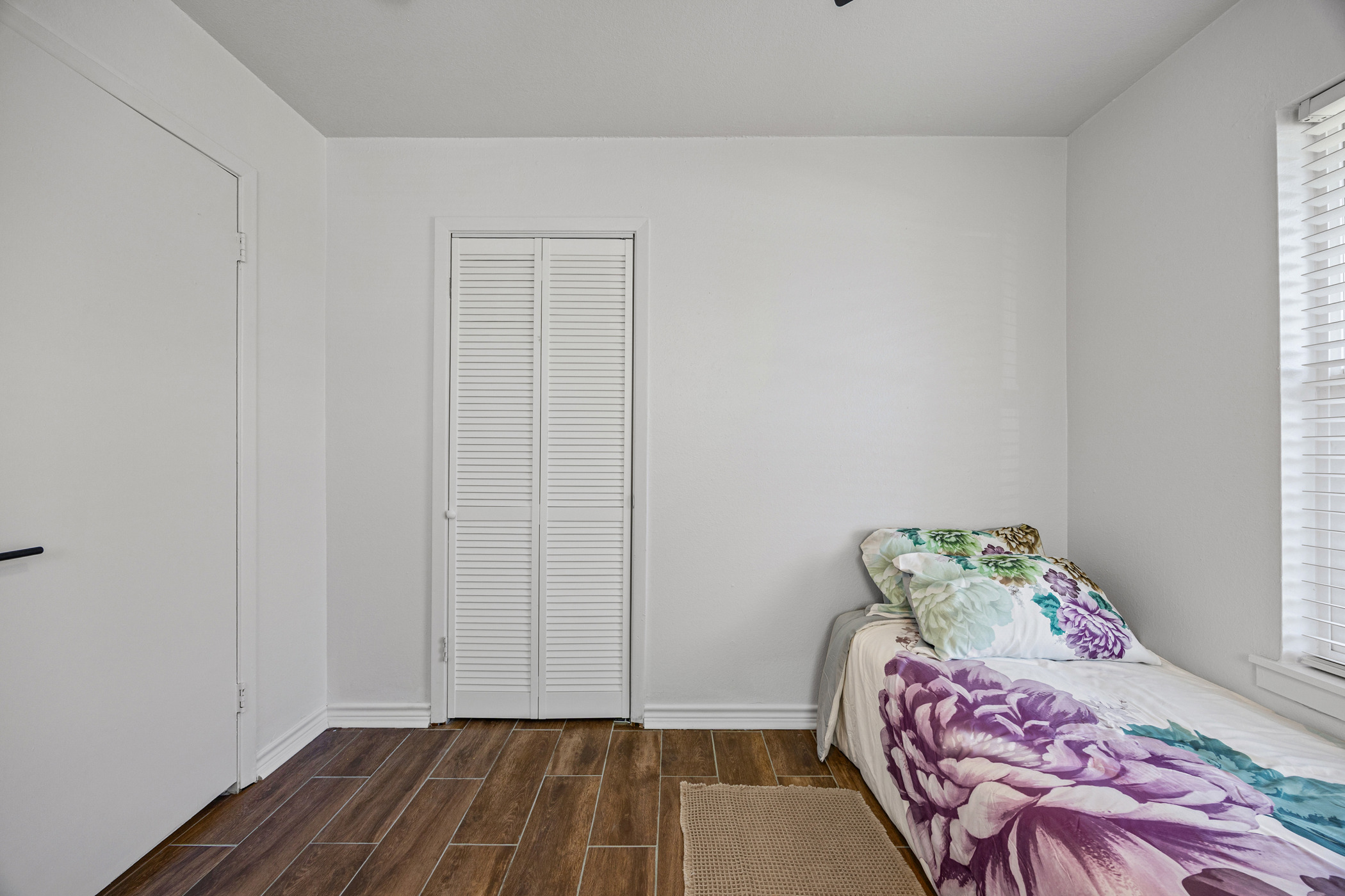 6010 Waycross Drive Austin, TX 78745 - Photo 20 of 22 a bedroom with a bed and curtain