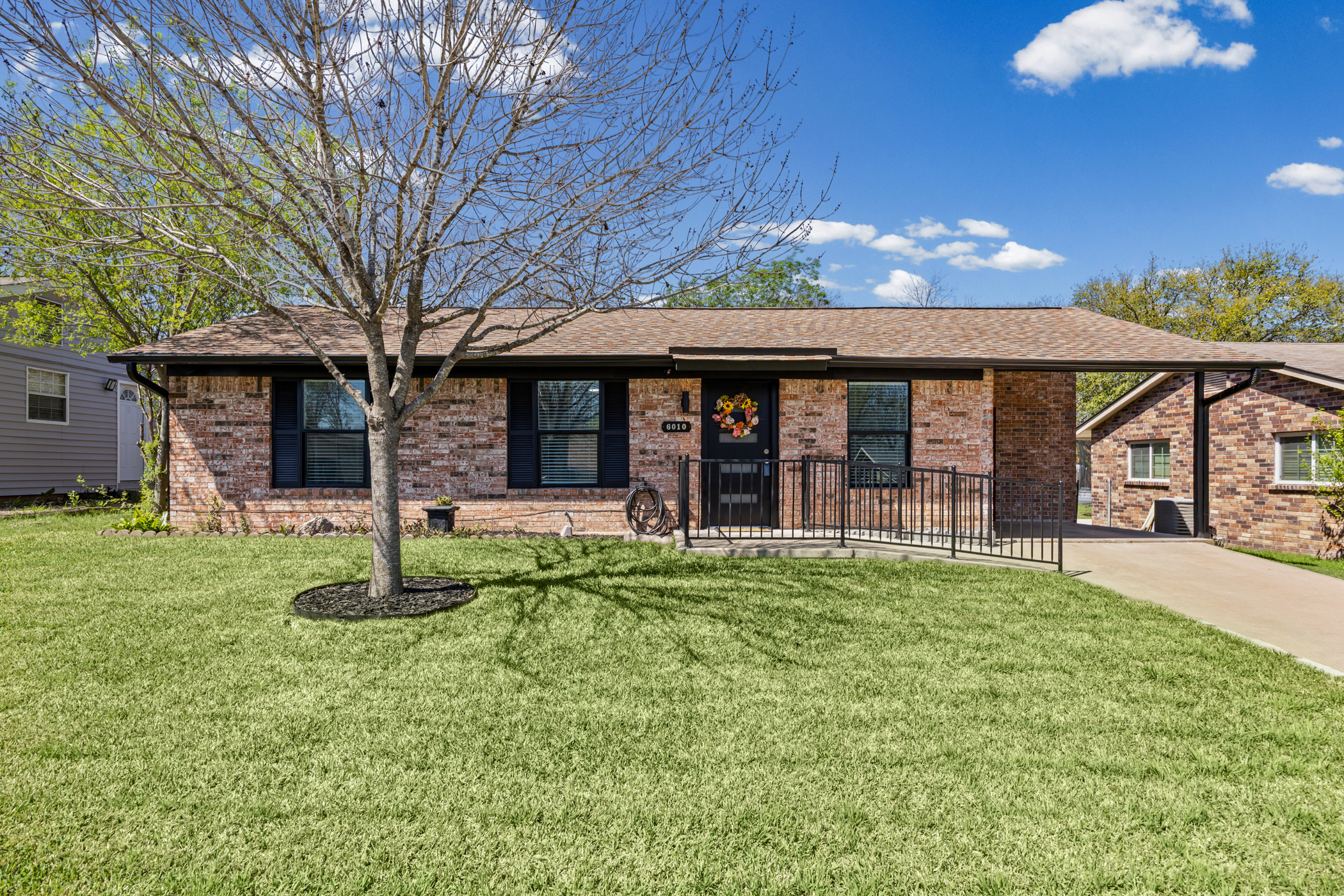 6010 Waycross Drive Austin, TX 78745 - Photo 2 of 22 front view of a house with a yard