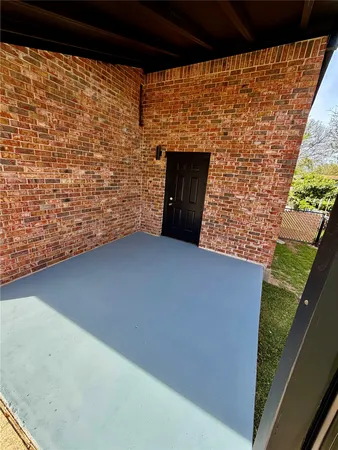 a view of an empty room and floor to ceiling window