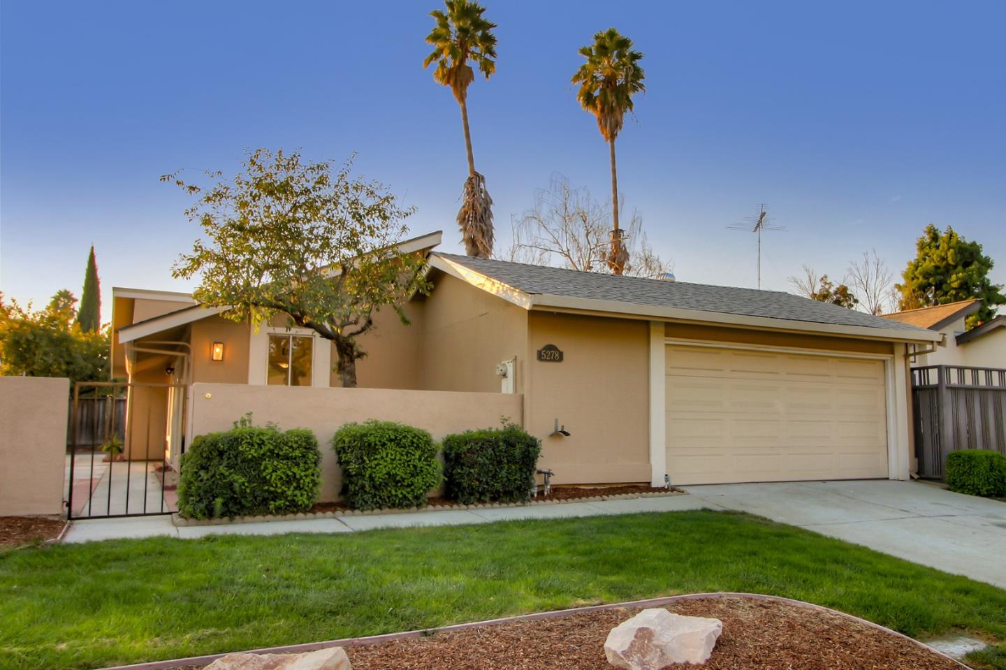 5278 Garrison Circle San Jose, CA 95123 - Photo 1 of 31 a front view of a house with a yard and garage