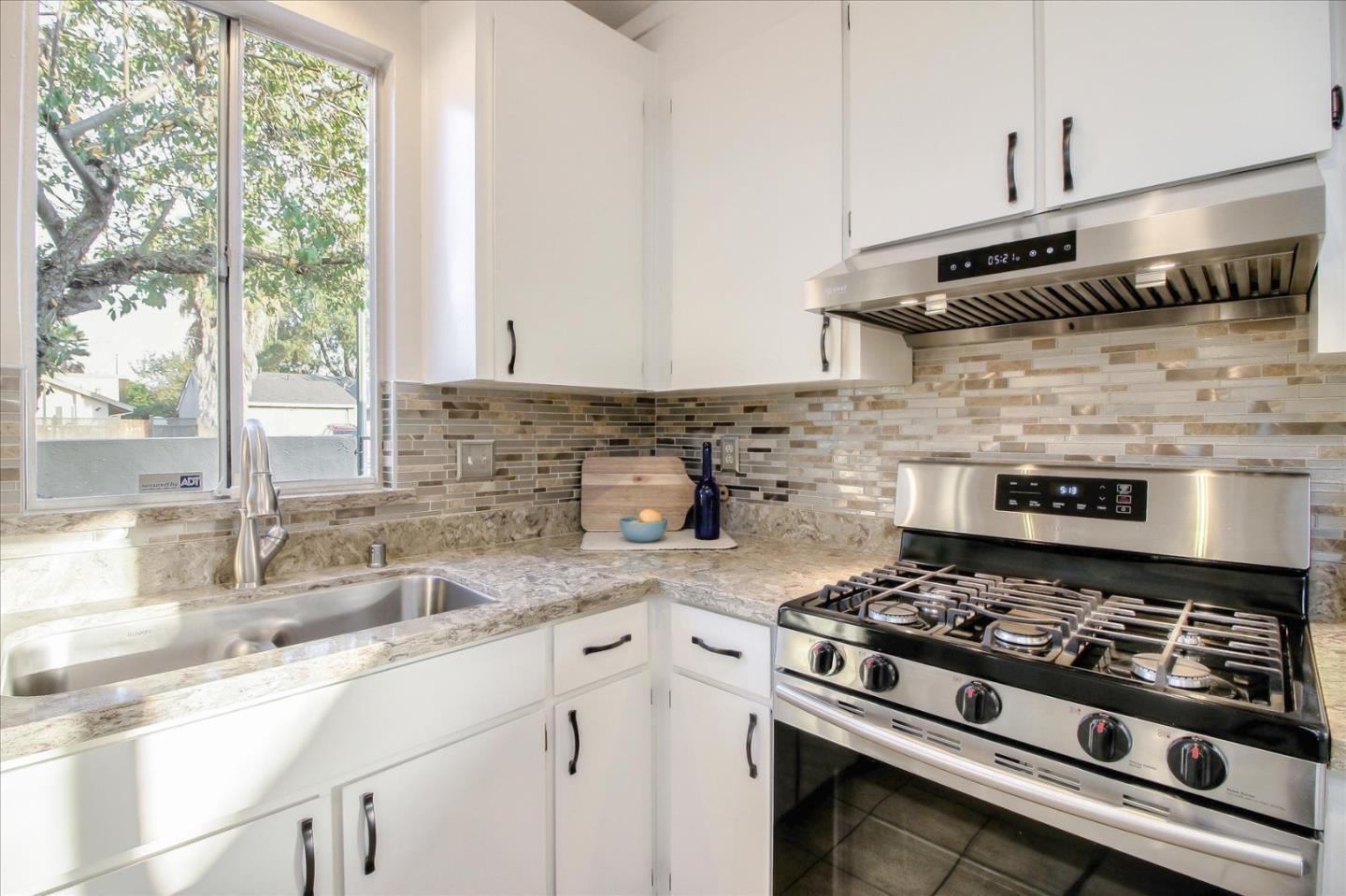 5278 Garrison Circle San Jose, CA 95123 - Photo 11 of 31 a kitchen with a stove and a sink