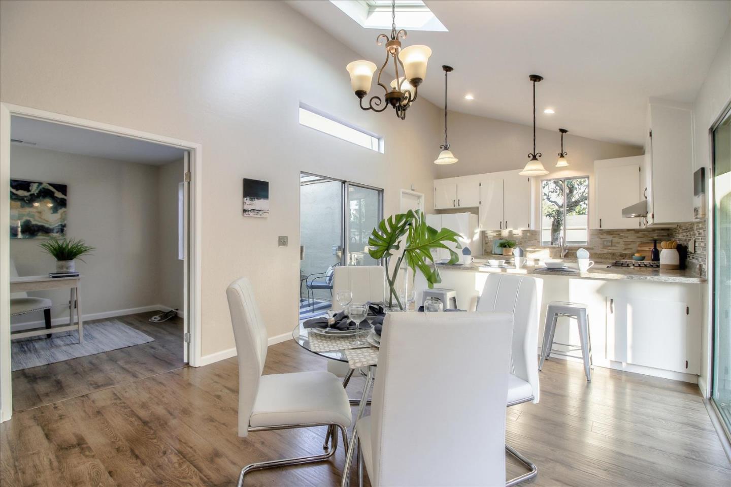 5278 Garrison Circle San Jose, CA 95123 - Photo 13 of 31 a dining room with kitchen island stainless steel appliances furniture a chandelier and kitchen view