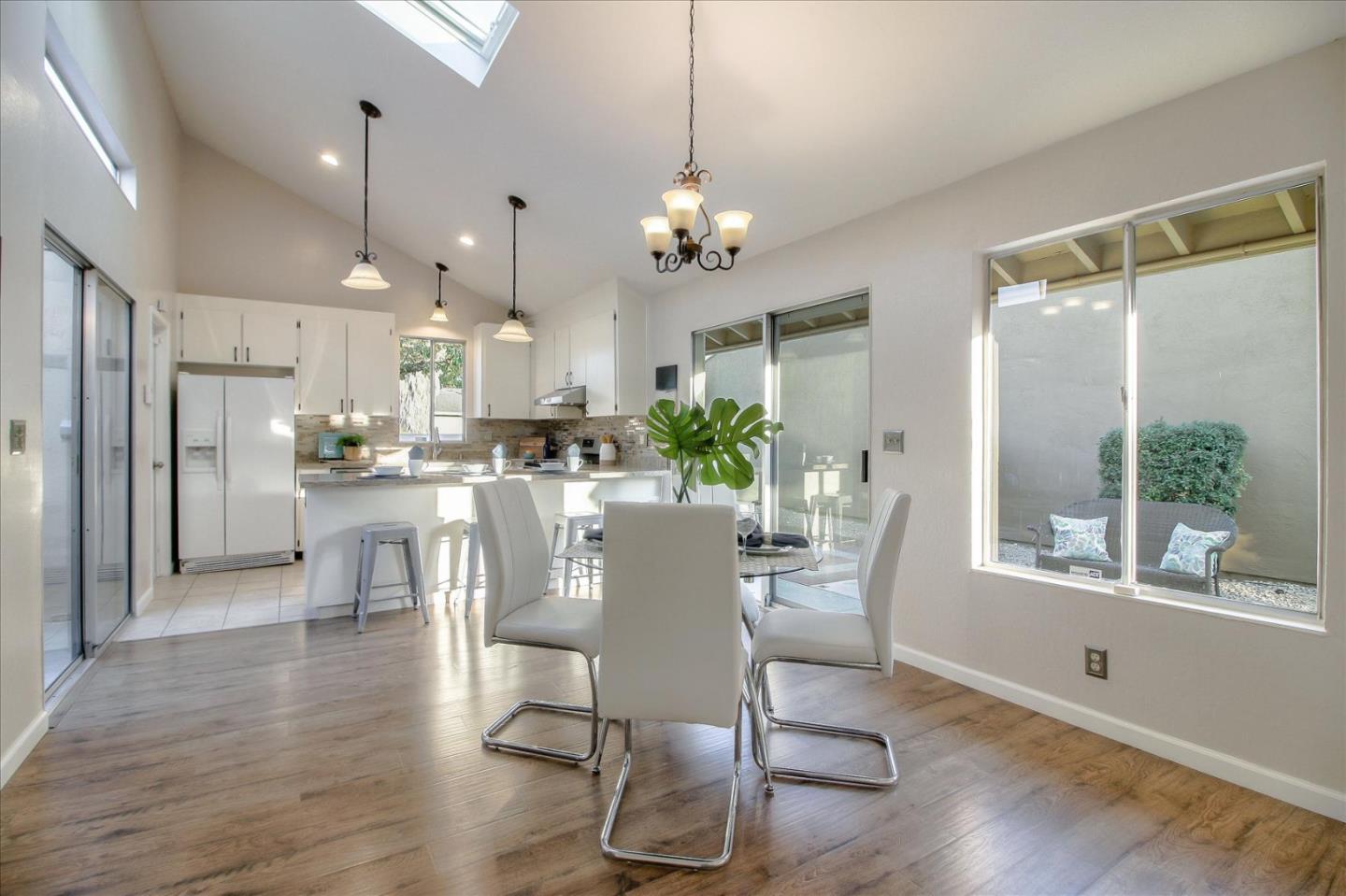 5278 Garrison Circle San Jose, CA 95123 - Photo 14 of 31 a dining room with stainless steel appliances kitchen island granite countertop a dining table chairs and granite counter tops