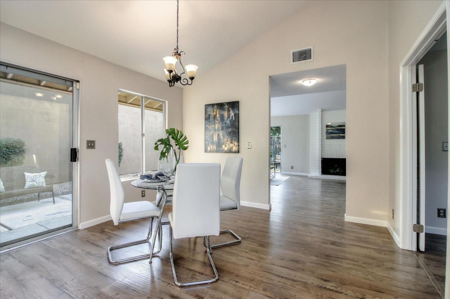 5278 Garrison Circle San Jose, CA 95123 - Photo 15 of 31 a view of a dining room with furniture wooden floor and a chandelier
