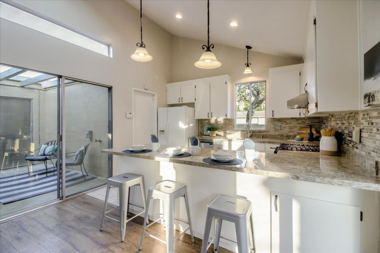 5278 Garrison Circle San Jose, CA 95123 - Photo 8 of 31 a kitchen with sink cabinets and dining table