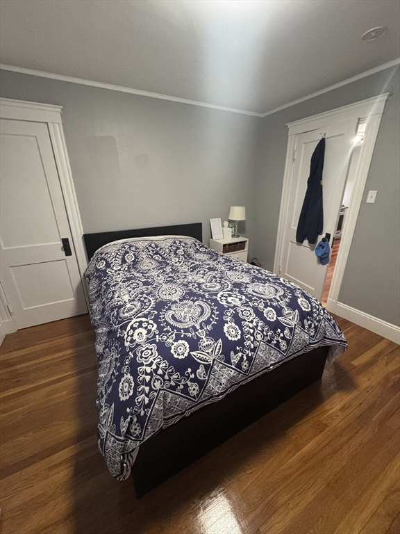 35 Mendelssohn Street, Unit 2 Boston, MA 02131 - Photo 6 of 13 a bed sitting in a bedroom next to a window