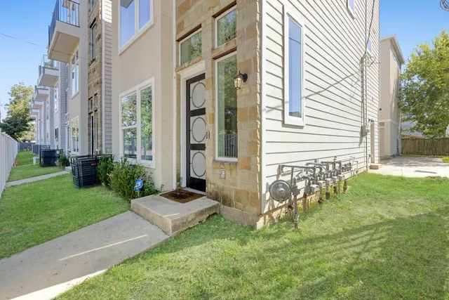 a view of a front of a house with a yard