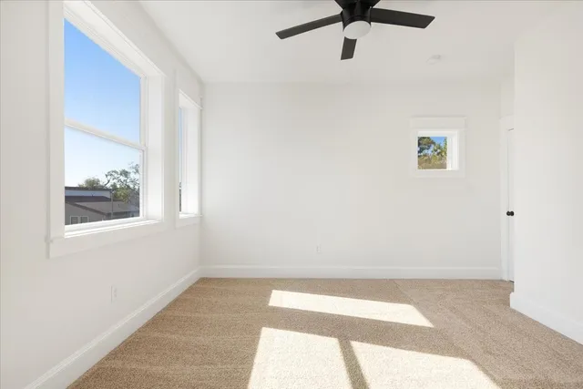 a view of room with a ceiling fan