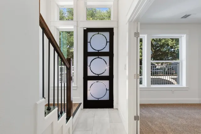 a view of entryway with wooden floor and window