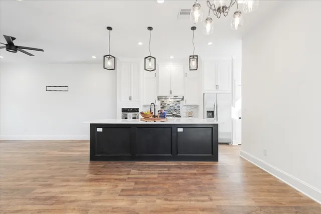 a room with a cabinets and wooden floor