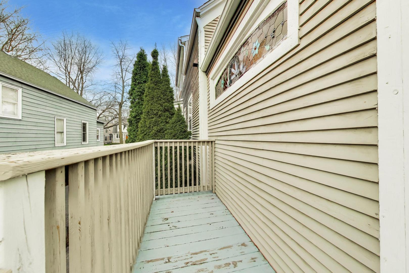 256 Blackhawk Road Riverside, IL 60546 - Photo 45 of 73 a view of a wooden balcony
