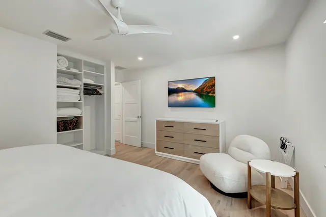 a bedroom with a bed and furniture